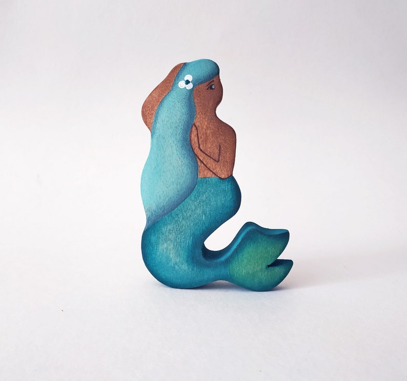 Mikheev Mermaid with Dark Skin and Blue hair